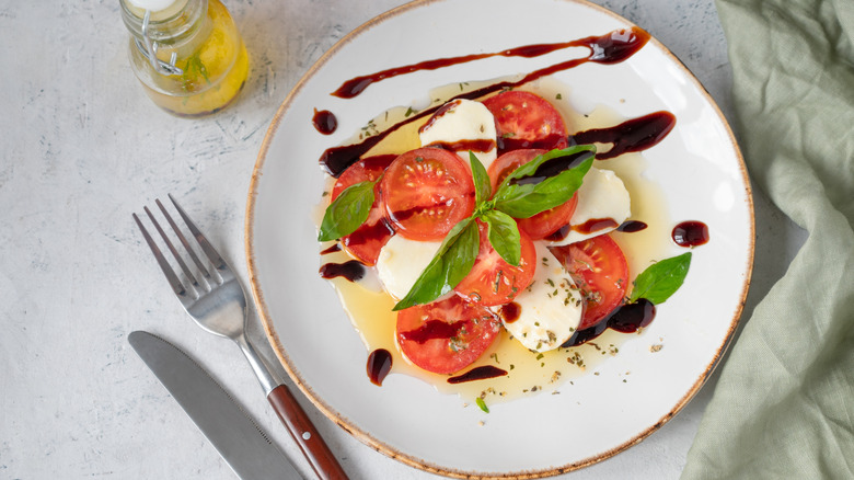 A Caprese topped with balsamic glaze