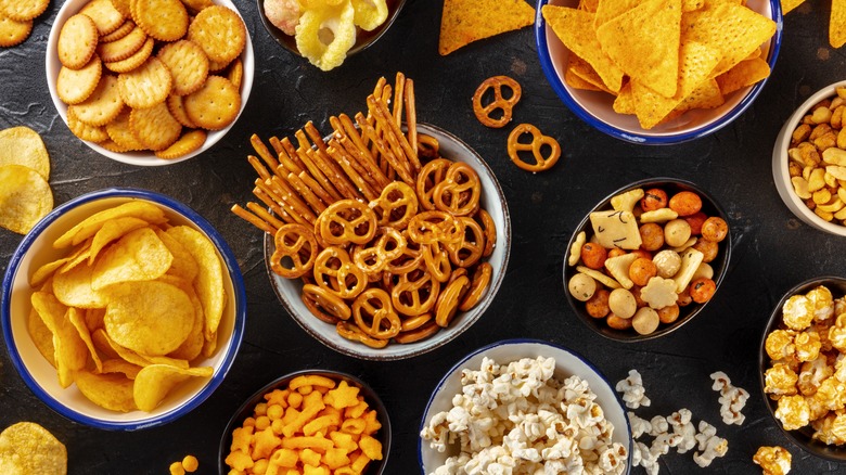 Spread of crunchy, crispy snacks in individual bowls