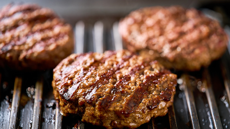Burger patties on a grill.