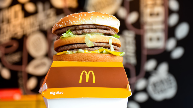 A double Big Mac sits on top of its box.