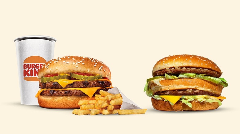 A Big Mac sits next to a Burger King Whopper.