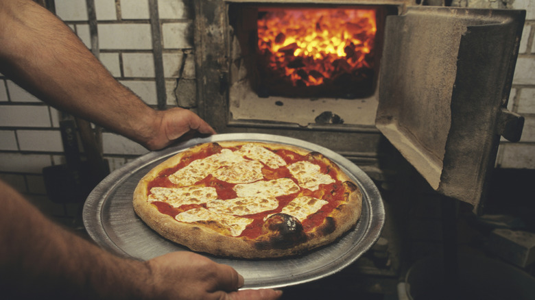 Pizza cooked in a coal oven at Lombardi's