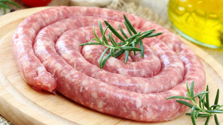 Raw luganega sausage with herbs