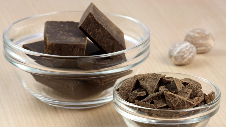 Two types of dark chocolate in glass ramekins