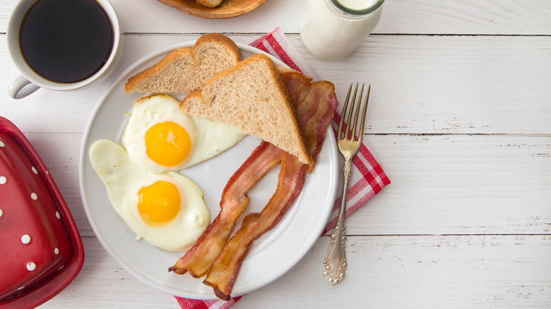 eggs, bacon, bread, and coffee