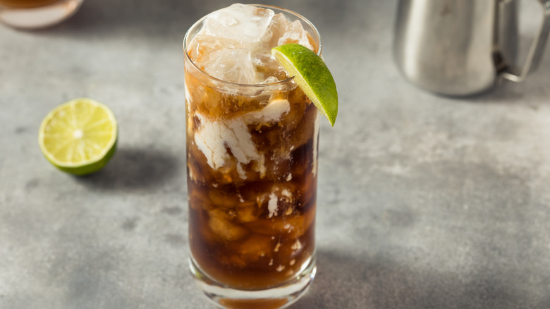 An assembled coconut dirty soda with a refreshing lime wedge.
