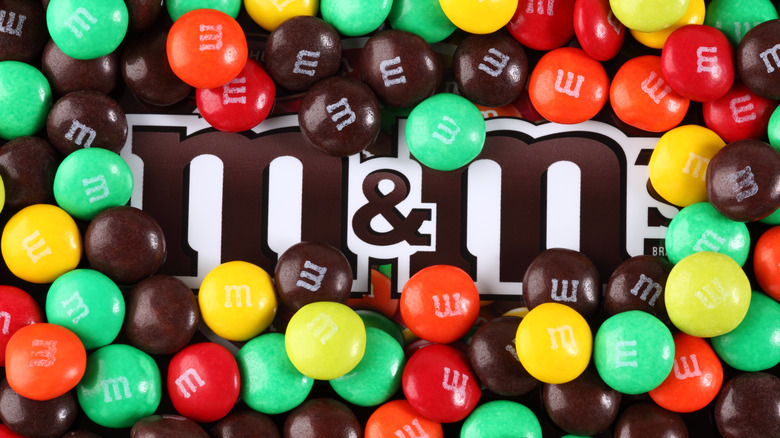 Original M&M's bag surrounded by M&M's candy