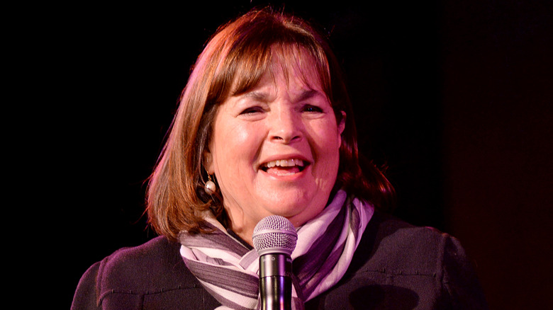 Ina Garten smiling into a microphone