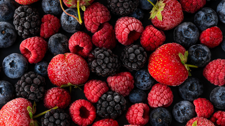 A closeup of various frozen berries