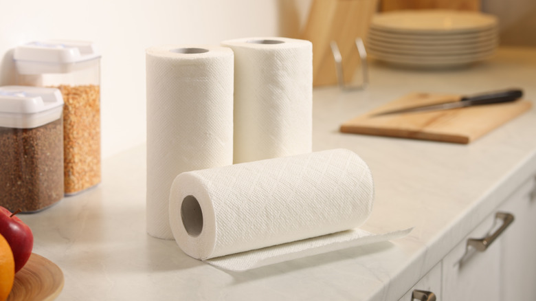 Three paper towel rolls on kitchen counter