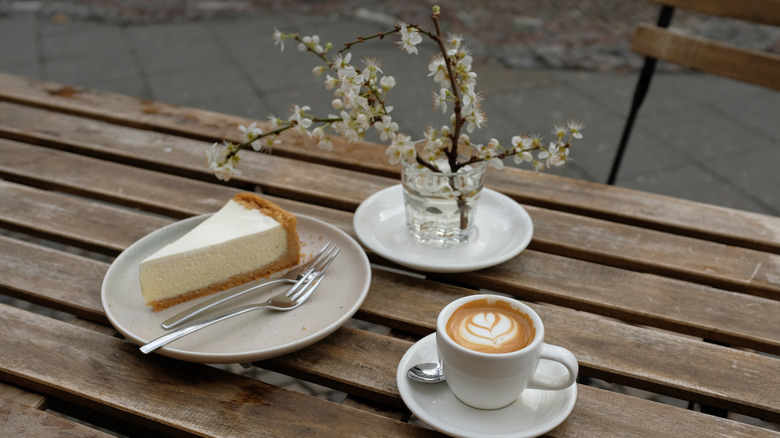 Slice of plain cheesecake with espresso