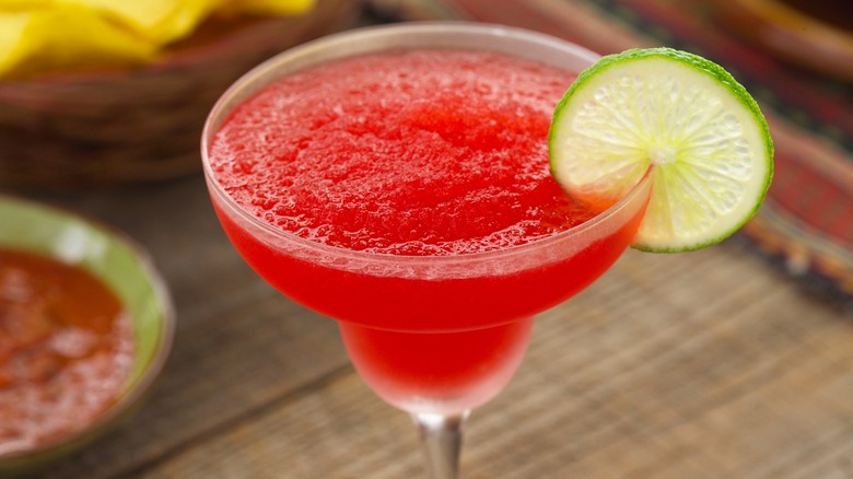 Frozen red margarita with lime slice