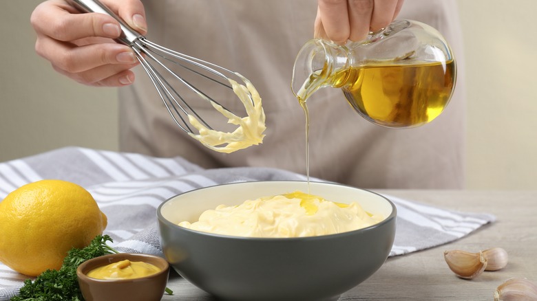 Person preparing homemade mayo