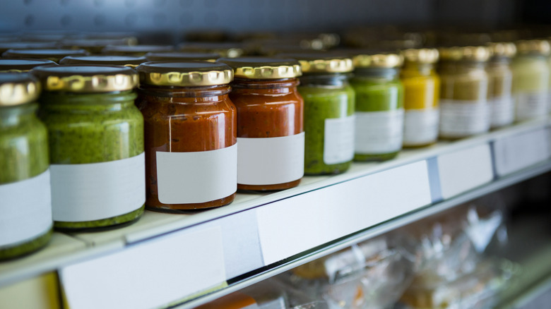 Pesto sauces on shelf at store