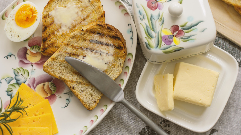 A beautiful floral butter dish and buttered toasts