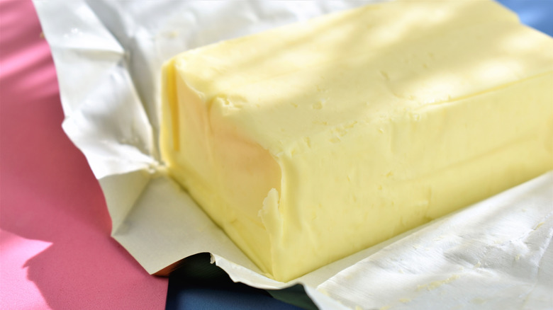 Stick of butter in its wrapper