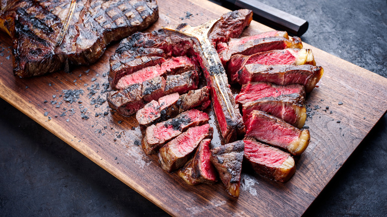 A porterhouse steak sliced into shareable portions.