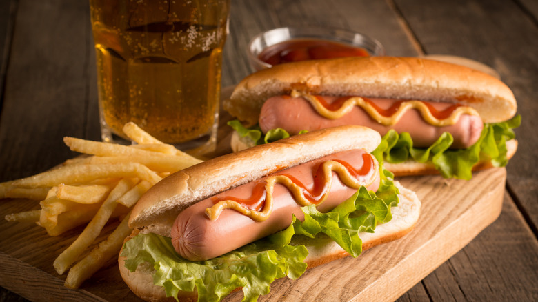 Loaded hot dogs and a glass of beer