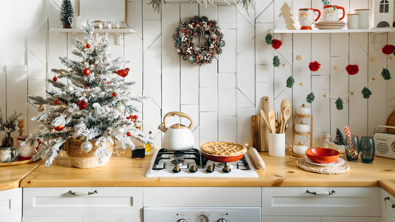 Christmas decor and a pie on a kitchen counter