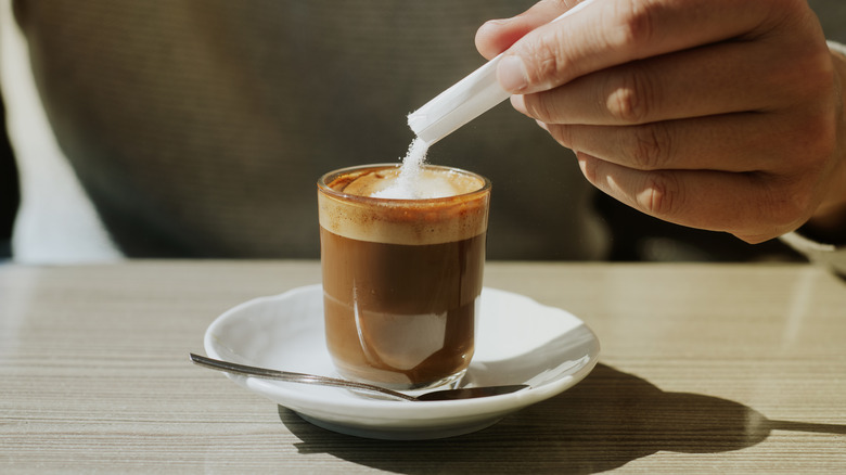 Adding sugar to coffee
