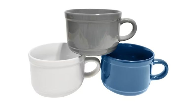 Three soup mugs, one blue, one white, and a gray resting on the other two