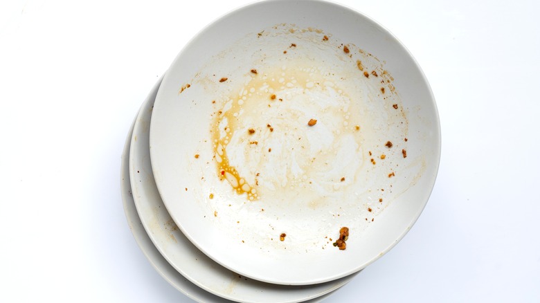 A stack of dirty plates
