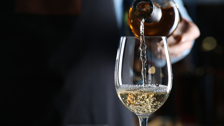 white wine poured in glass
