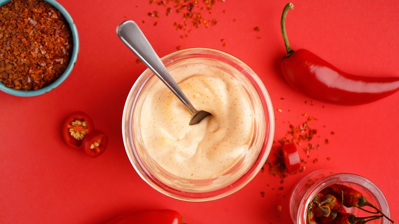 Bowl of chipotle mayo with assorted chilies