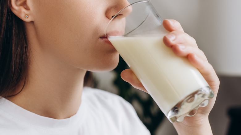 Person drinking glass of milk