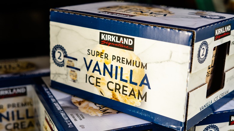 Case of Kirkland Signature ice cream atop others