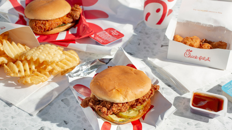 An array of Chick-fil-a food, waffle fries, nuggets and a sandwich