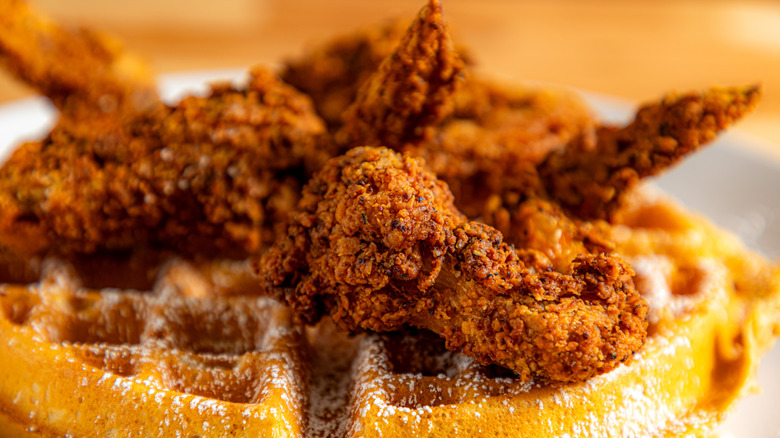 Fried chicken wings on top of a waffle