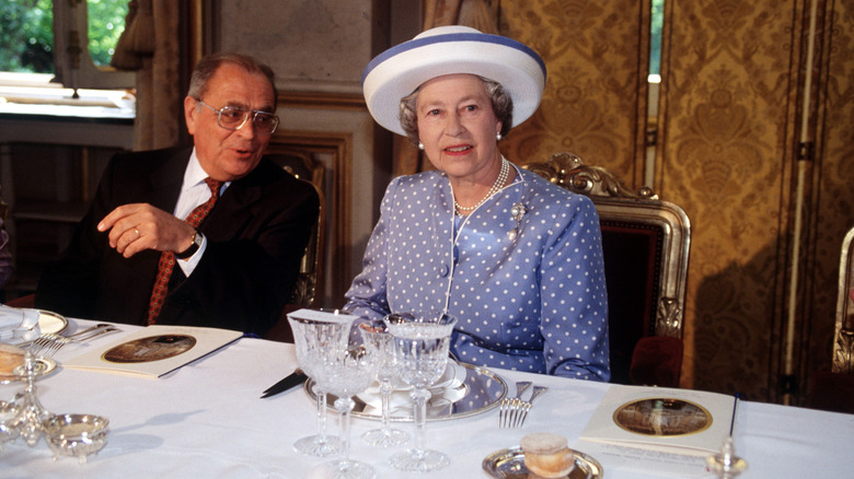 Queen Elizabeth II at a meal in France