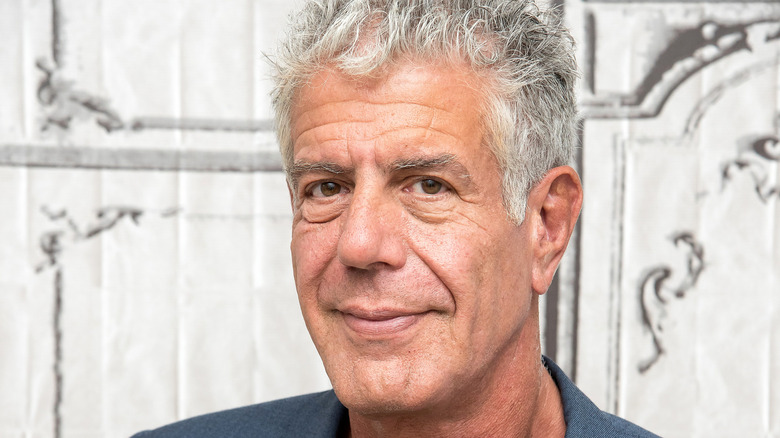 Anthony Bourdain in front of white background
