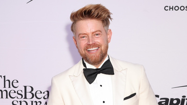 Richard Blais posed in front of step and repeat