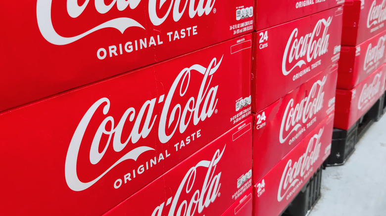 24-packs of Coca-Cola on palettes