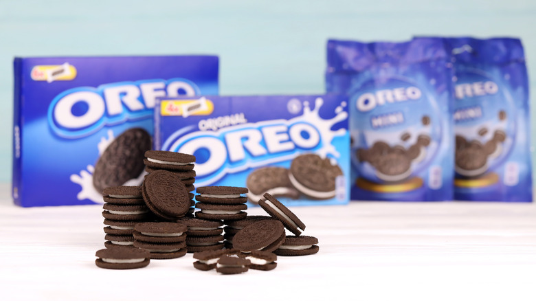 pile of oreos in front of packages