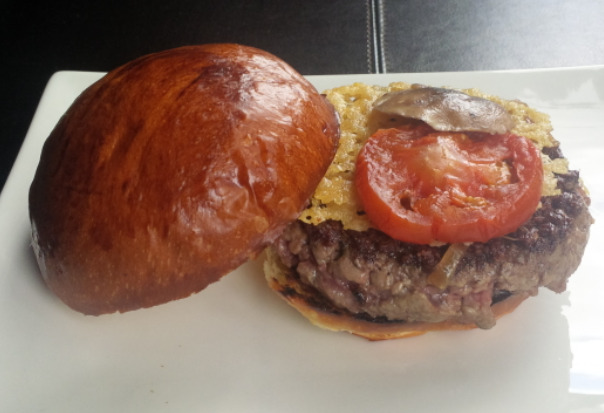 The Original Burger features a Parmesan crisp, shiitake mushroom, tomato and caramelized onions.