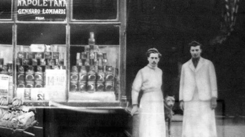 Antique photo of two men and dog at Gennaro Lombardi's grocery pizzeria