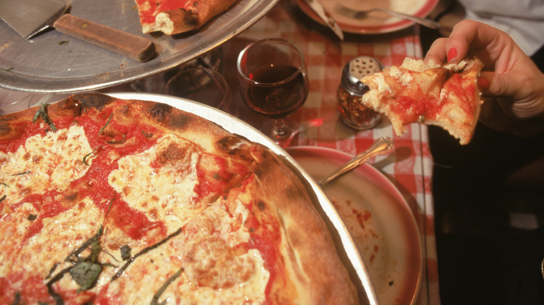 New York style Lombardi's pizza on dining table