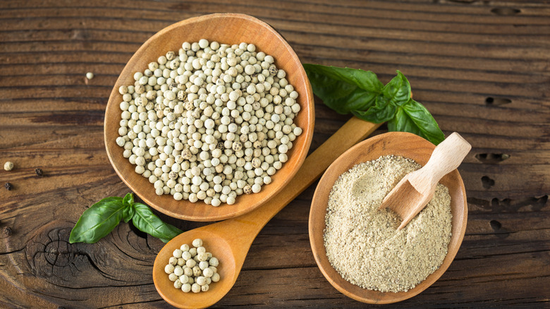 Whole and ground white peppercorns
