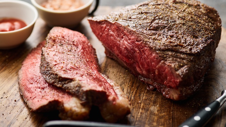 rump cut steak on wooden table