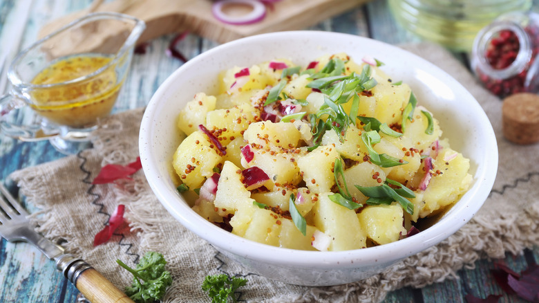 mustard potato salad with green and red onion