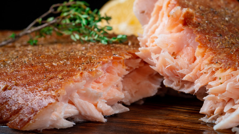 close up of smoked salmon on wood