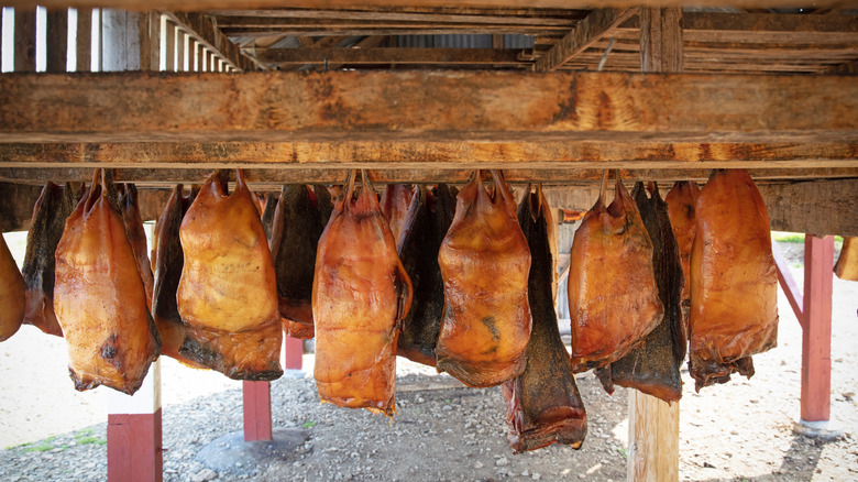 hákarl hanging from wooden beams
