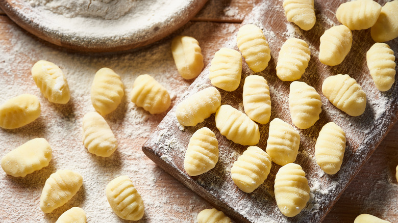Raw gnocchi on cutting board