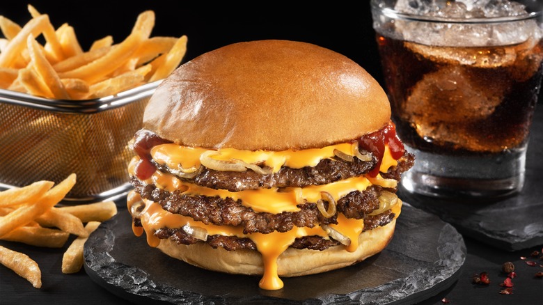 A triple-patty smash burger with cheese
