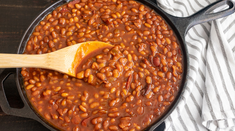 Serving of baked beans simmered in a pan.