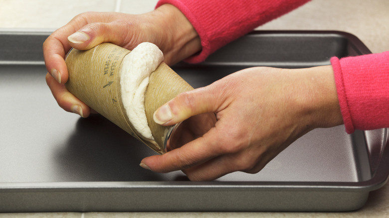 Opening can of biscuit dough