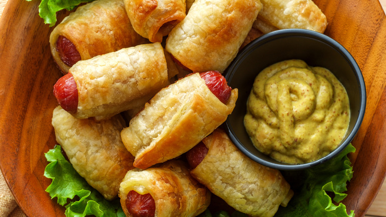 Pigs in a blanket with mustard